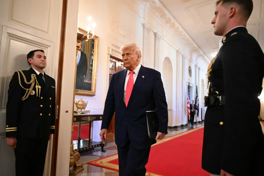 President Trump heads to the East Room of the White House to sign an executive order.